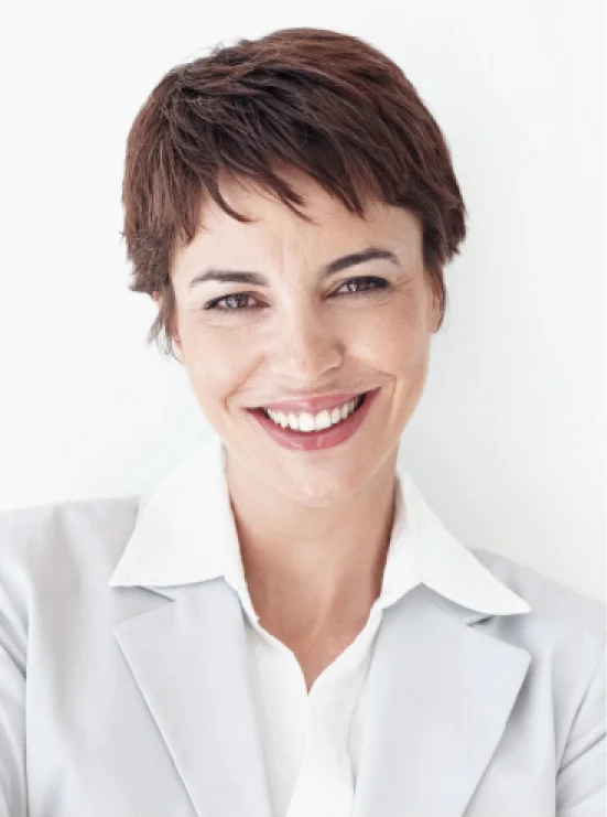a woman in white clothes with a short haircut