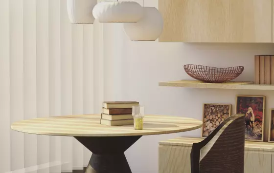 uma sala iluminada com livros sobre a mesa