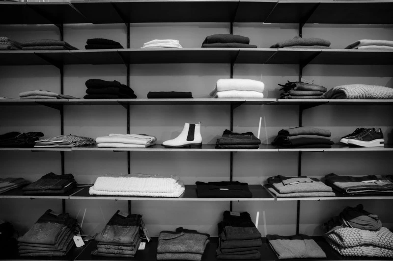 shelves on which shoes and clothes