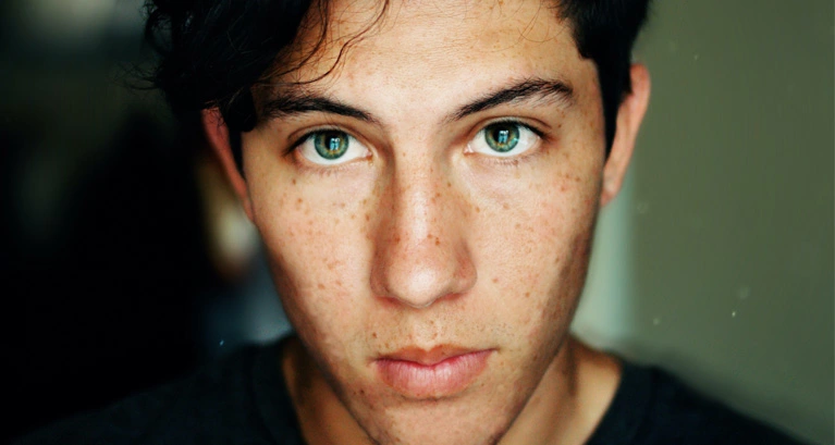 a boy with green eyes
