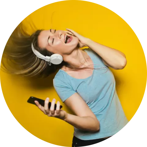 a girl in headphones and with a phone in her hands