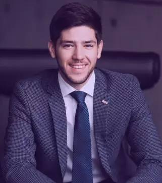 Young smiling man in suit