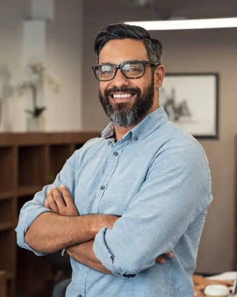 a man in a shirt with glasses and a beard