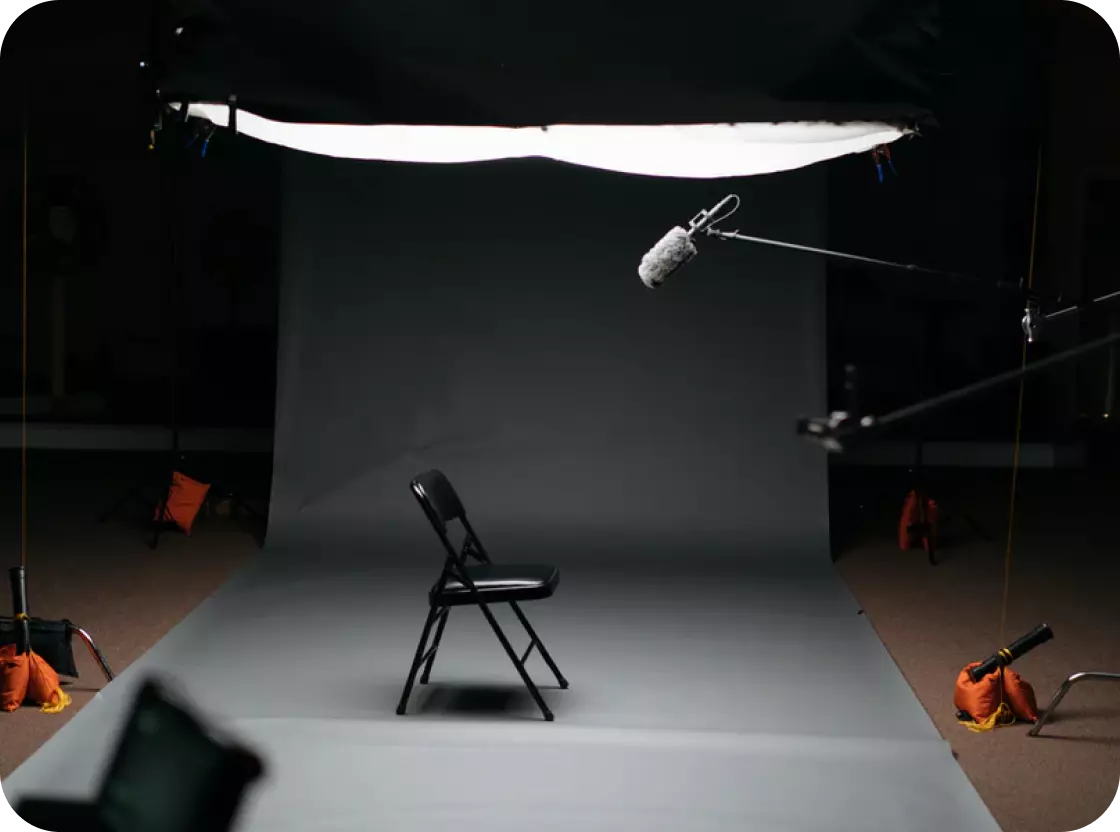 photo studio and a chair standing in the middle of the room