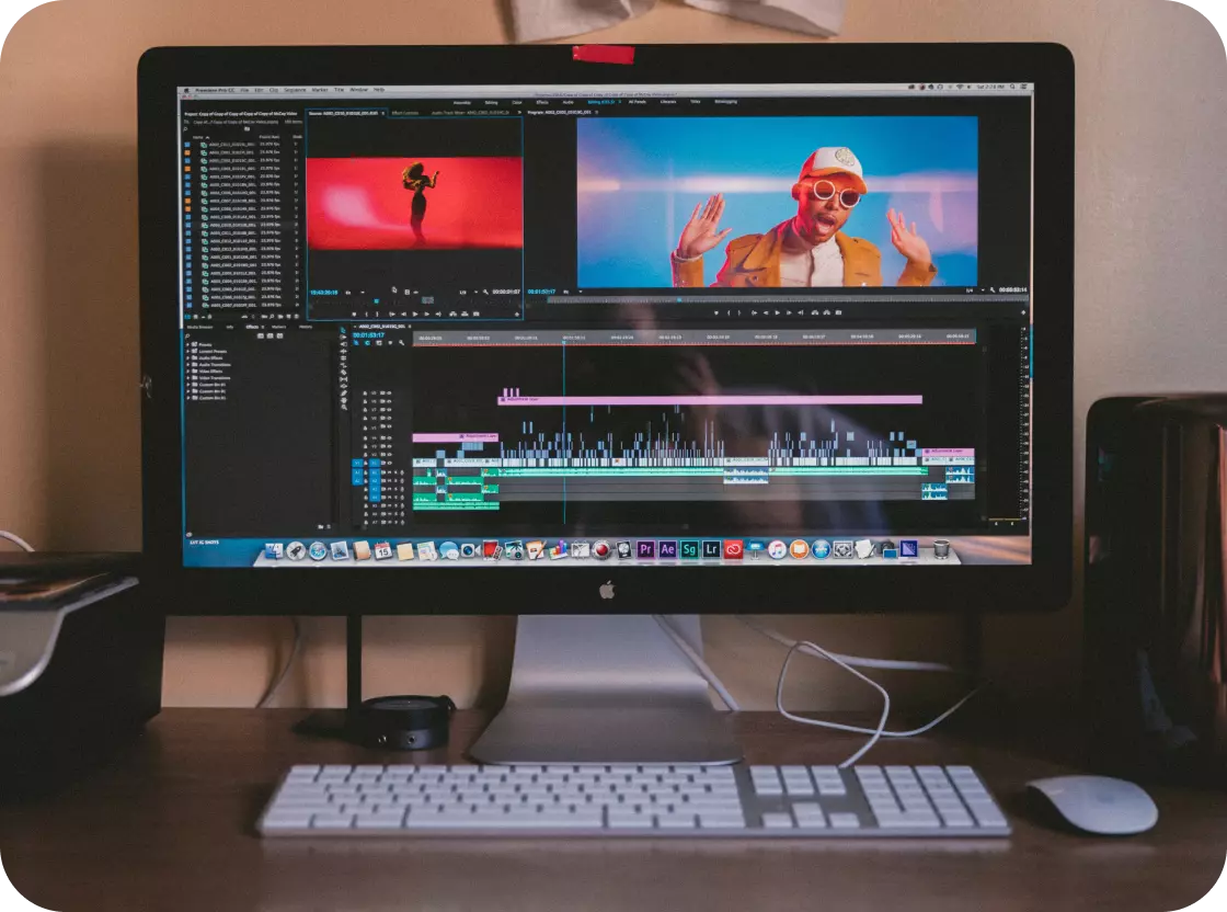 there is a monitor and keyboard on the table