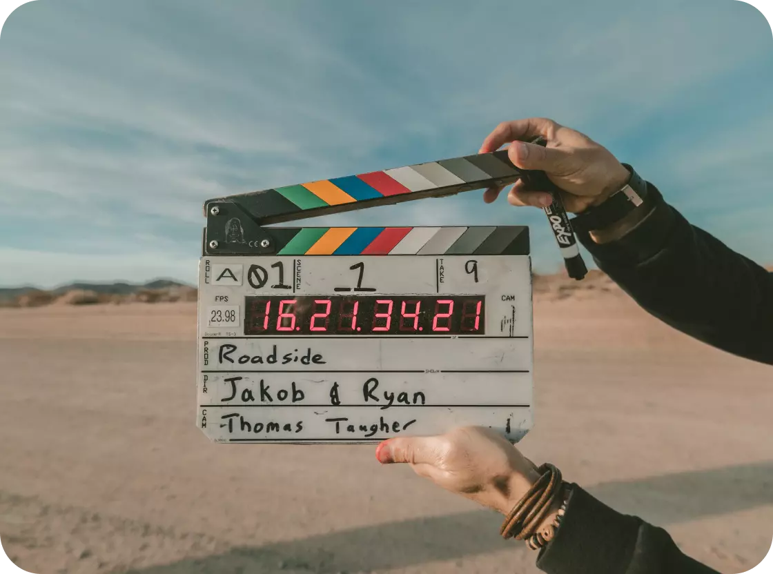 a man holding a device for filming