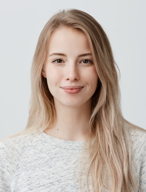 a young woman with blonde hair on a white background