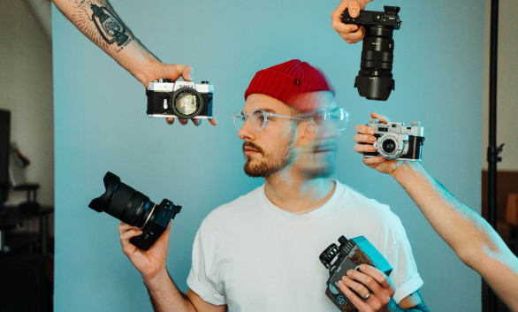 man with cameras