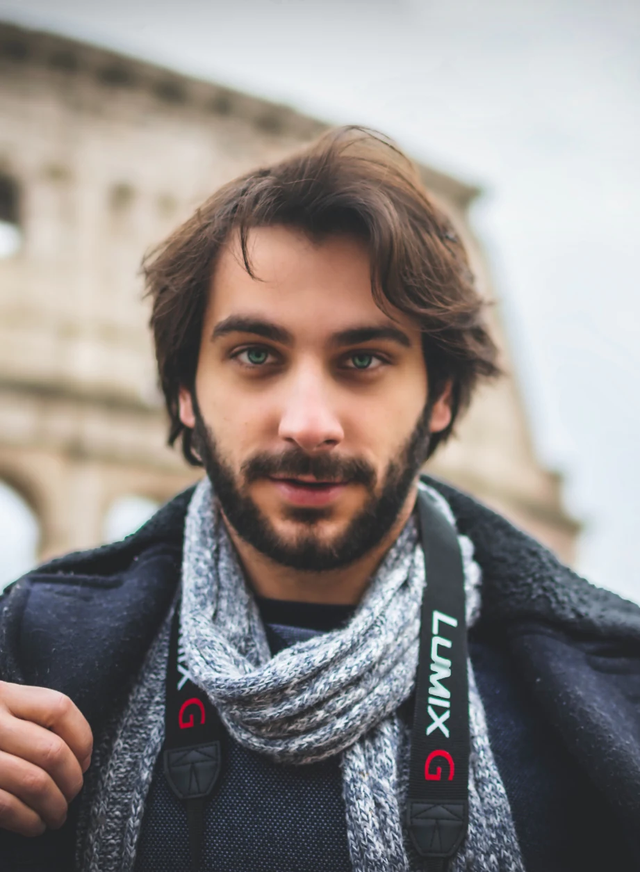 a man with a scarf and a beard