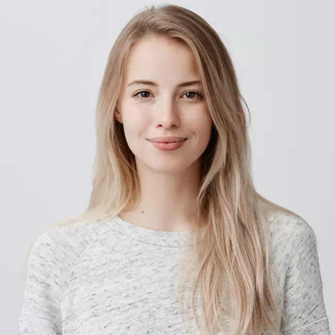 Blonde girl in a gray sweater