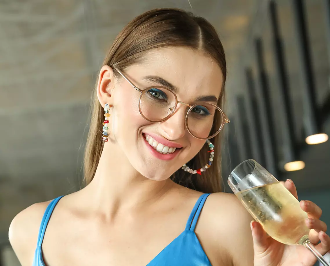 a girl in a blue dress with glasses