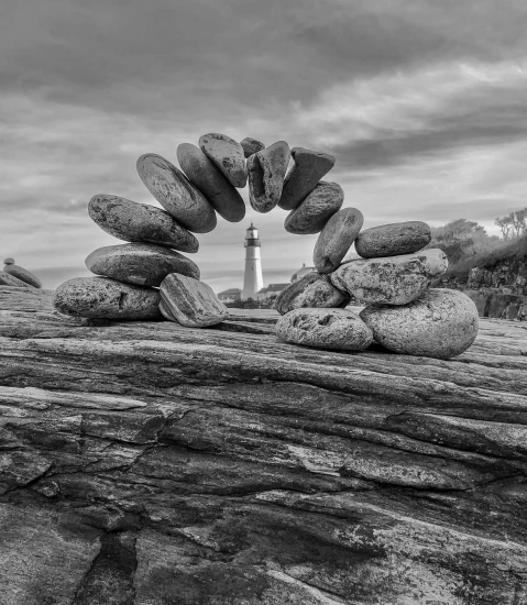 stone-arch-made-with-pebbles-showing-lighthouse