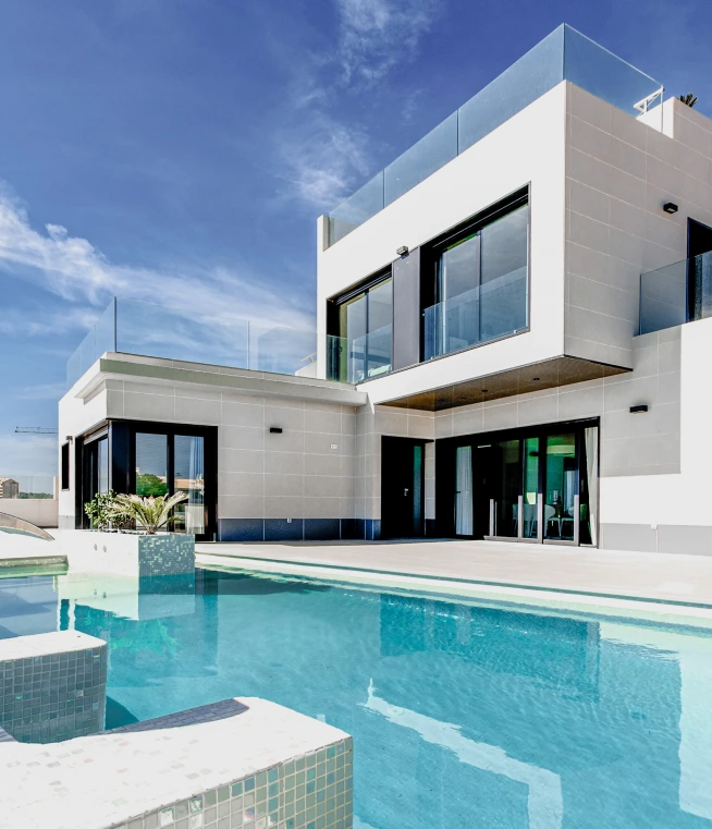 white panel house with private swimming pool