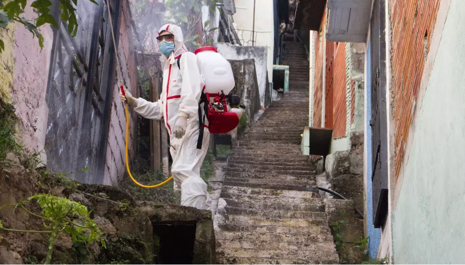 an employee in a protective white suit