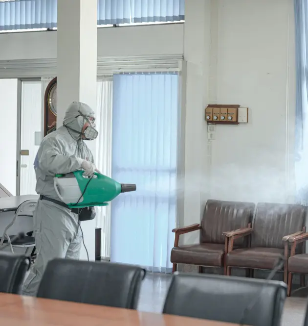 an employee in a protective white suit