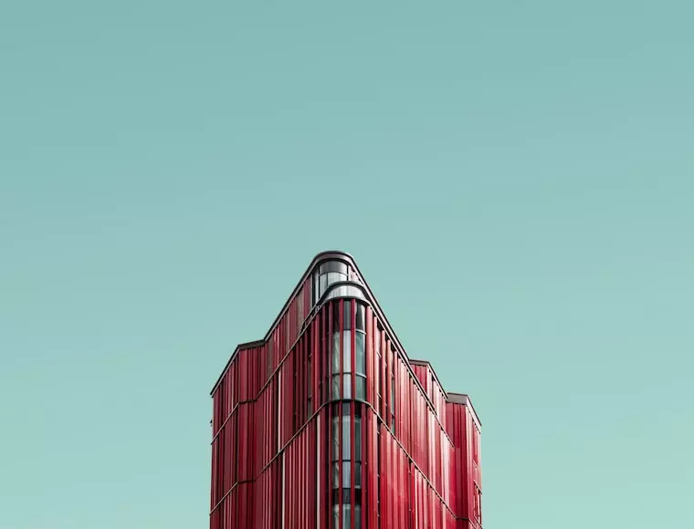 The red building has a non-standard shape with rounded corners.