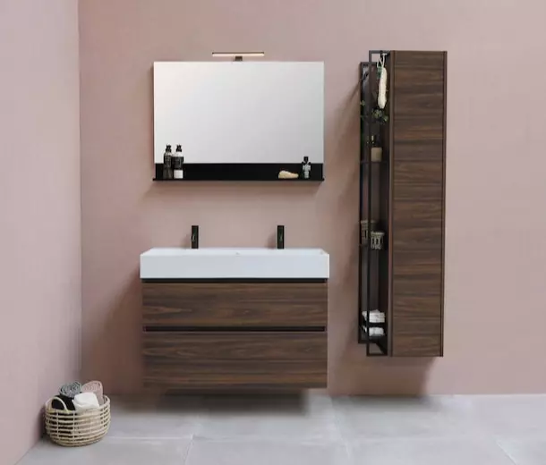 Washbasin in the bathroom built into brown furniture