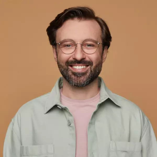 a man in glasses with a beard