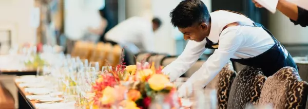 waiter stand by the table