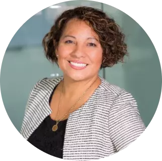 smiling woman with curly hair and short haircut