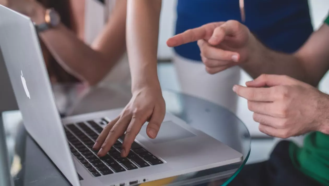 hand gestures in front of macbook