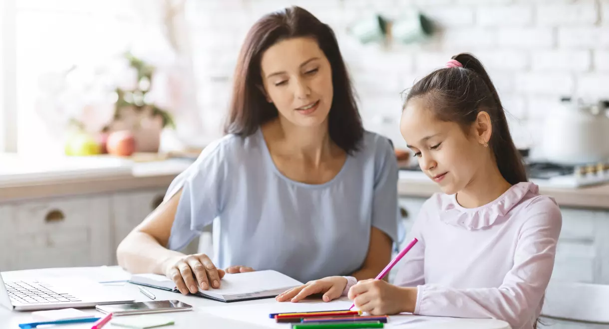 A woman teaching a child