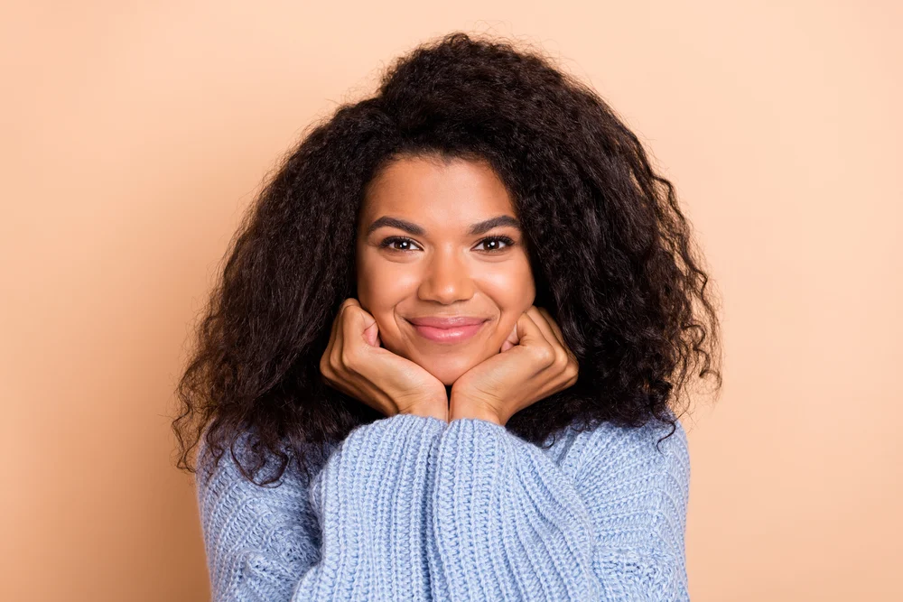 a girl in a lavender sweater