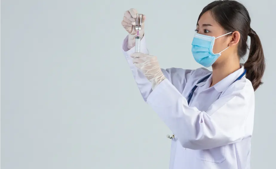 a doctor puts medicine into a syringe