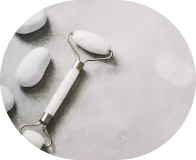 facial massager with white stone