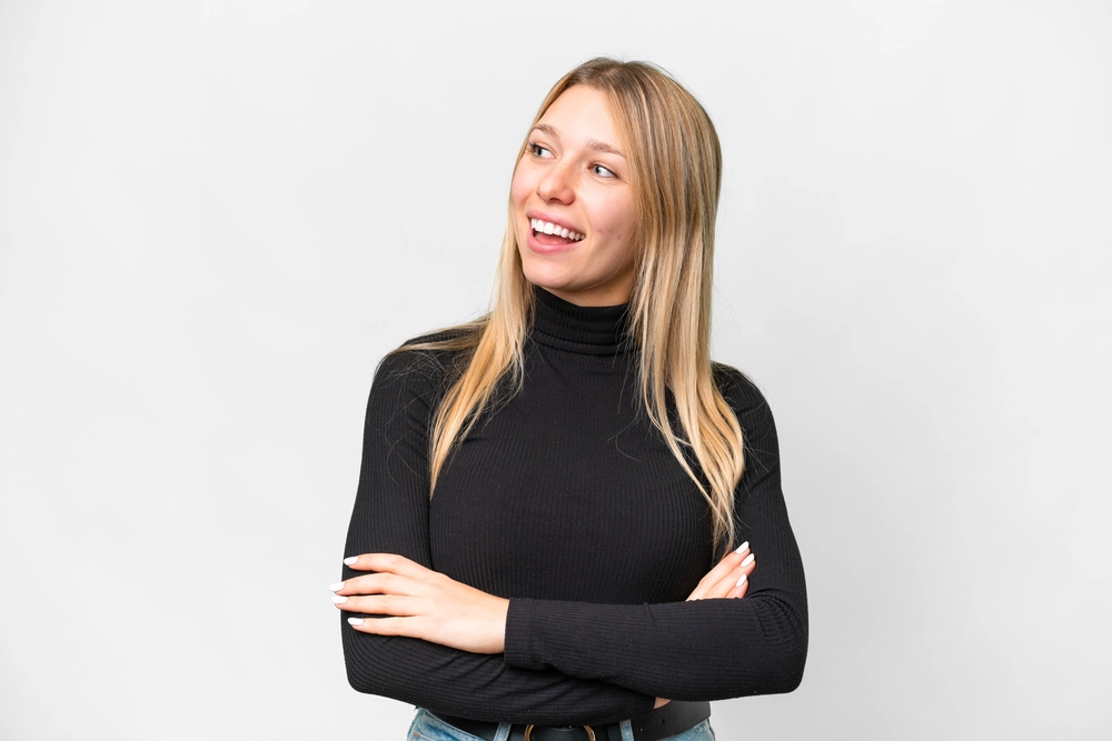 blonde with a wide smile in black clothes