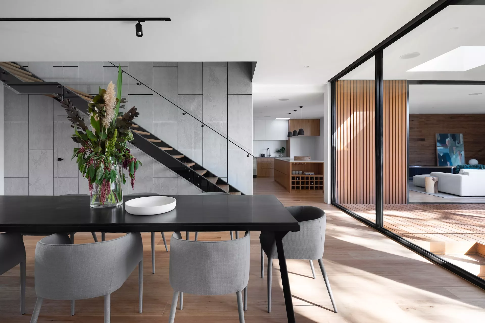 living room in light colors and with stairs leading to the top