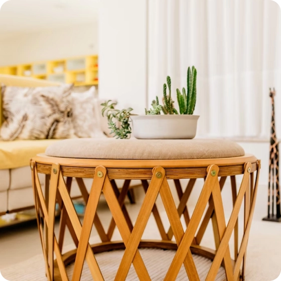 round wooden table with flowers on it