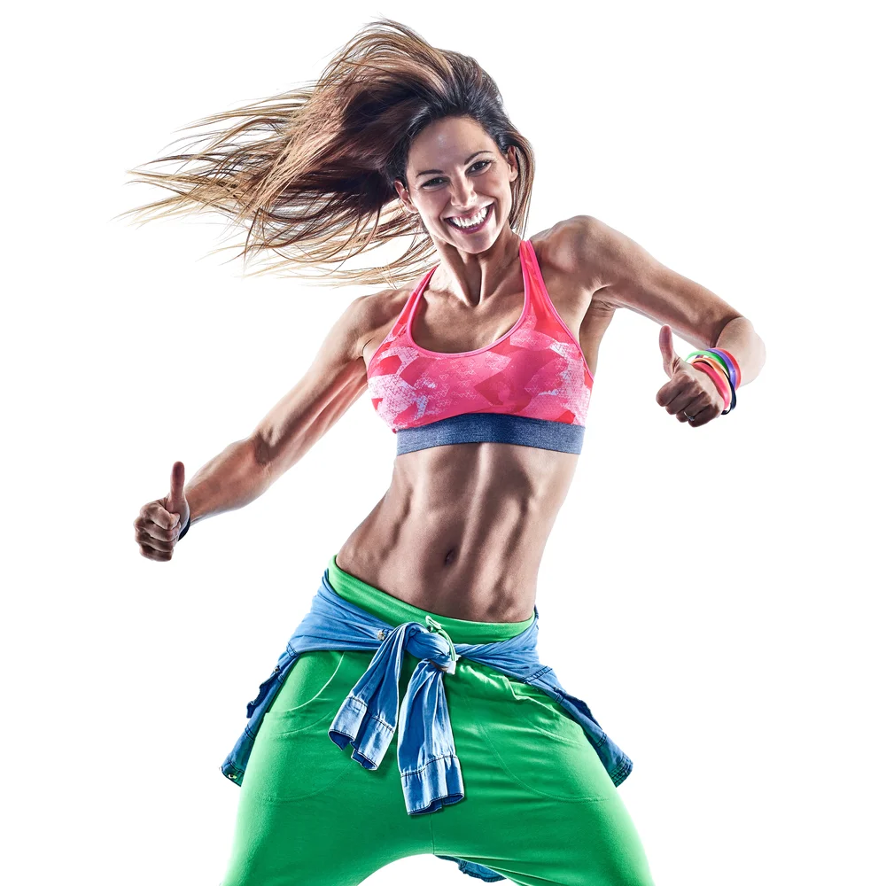 girl in bright clothes dancing smiling widely