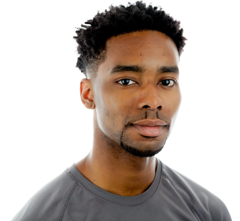 young guy with a beard and a beautiful hairstyle