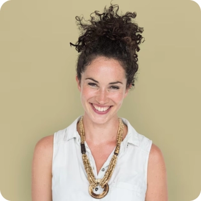 smiling girl with dark hair and a high hairstyle