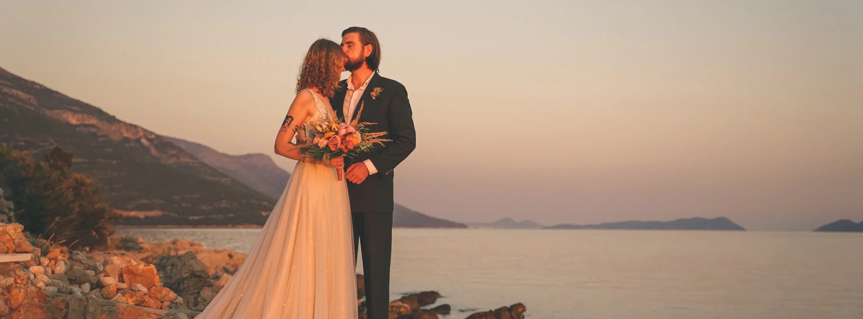 the groom kisses the bride