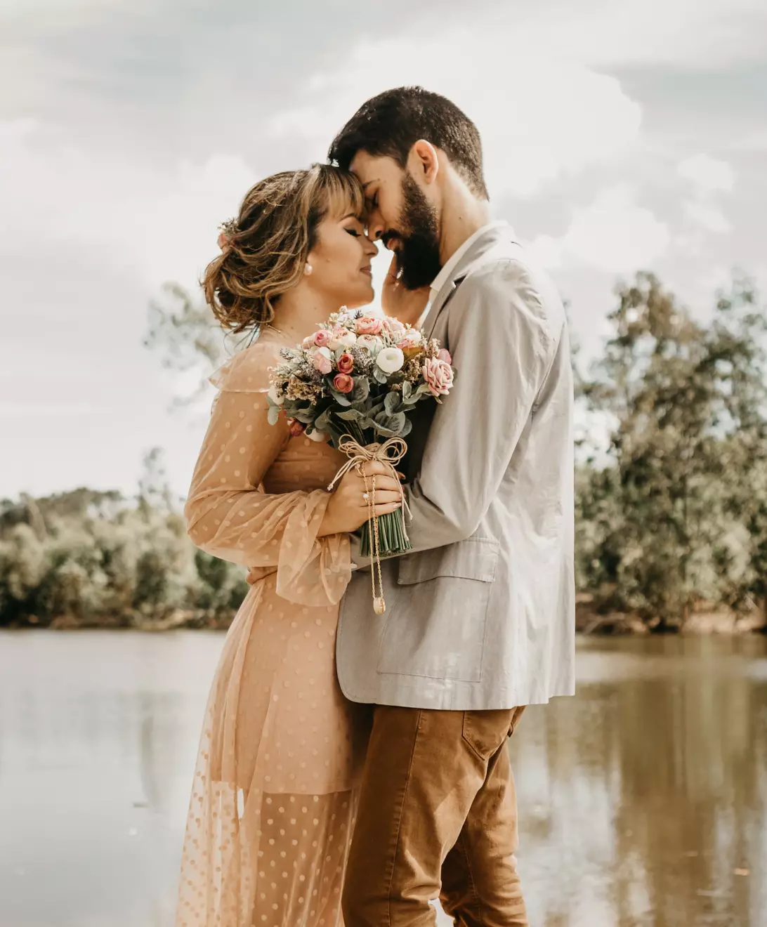 Newlyweds against the river