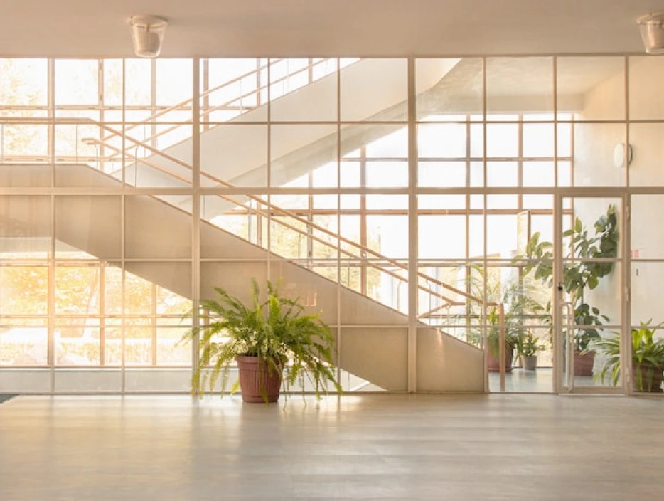 Hall with glass walls to the floor, overlooking the staircase