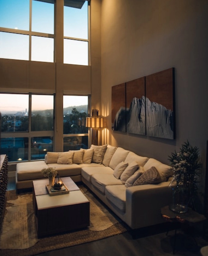 large living room with a huge corner sofa and large panoramic windows