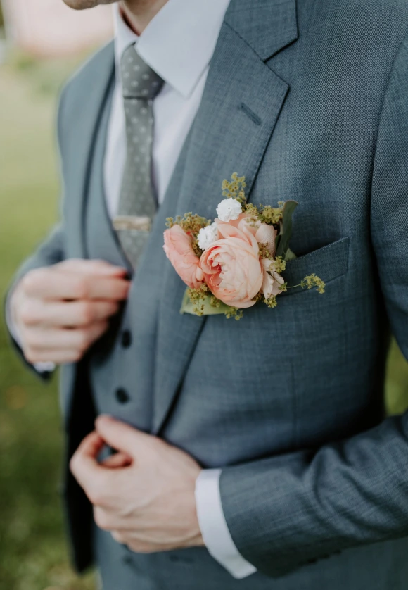 the groom in a gray suit