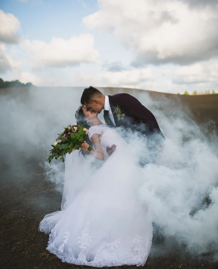 the bride and groom kiss