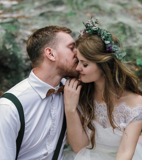 the groom kisses the bride