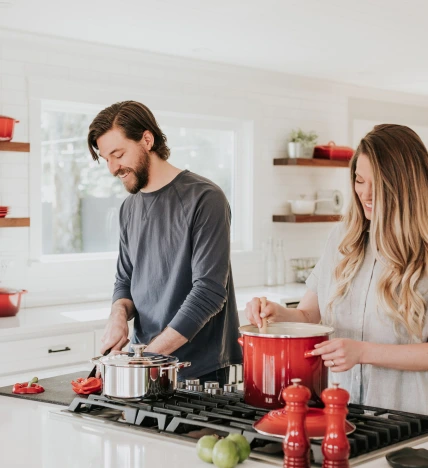 girl and boy cooking