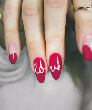 a girl with a red manicure