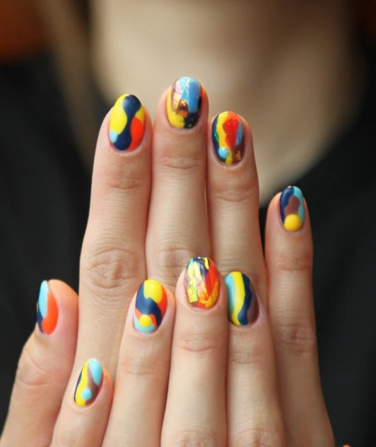 a girl with a colored manicure