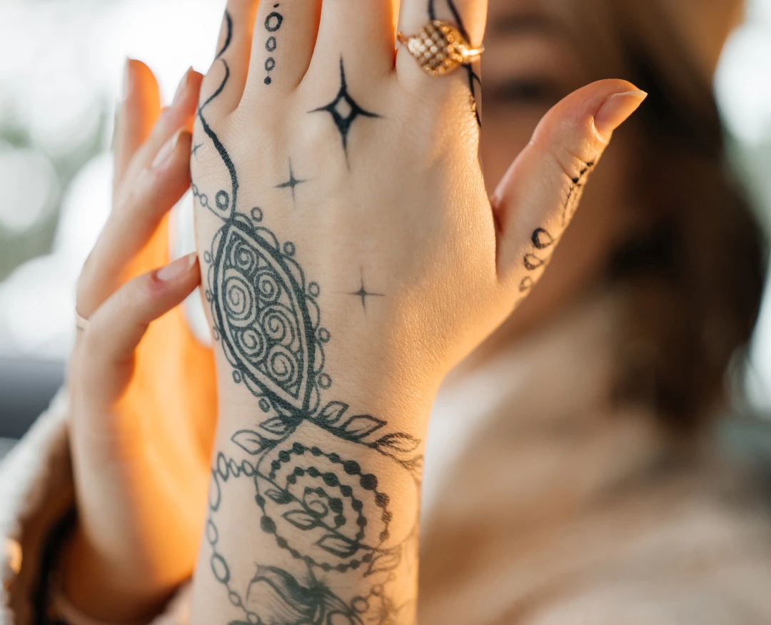 a girl with a tattoo on her arm
