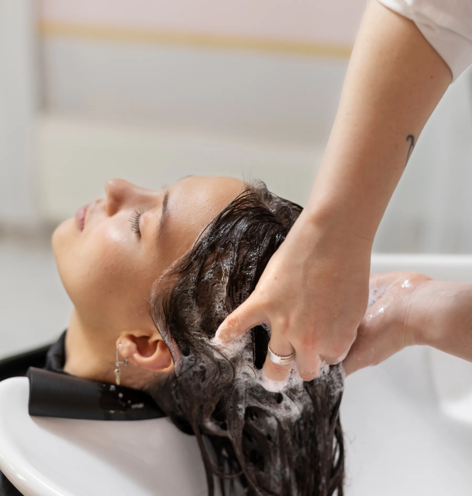 female hands washing their hair