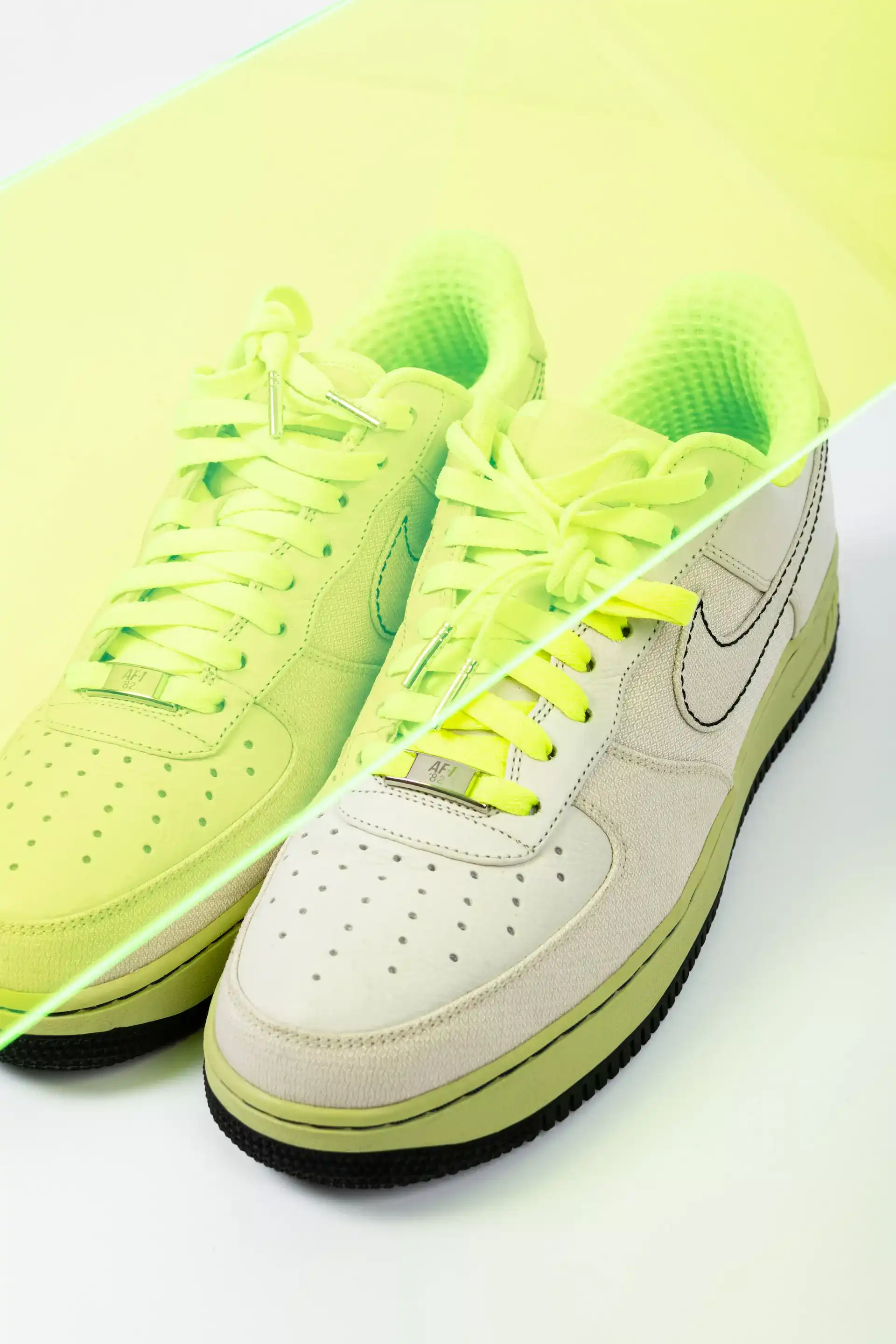 white sneakers with bright green elements