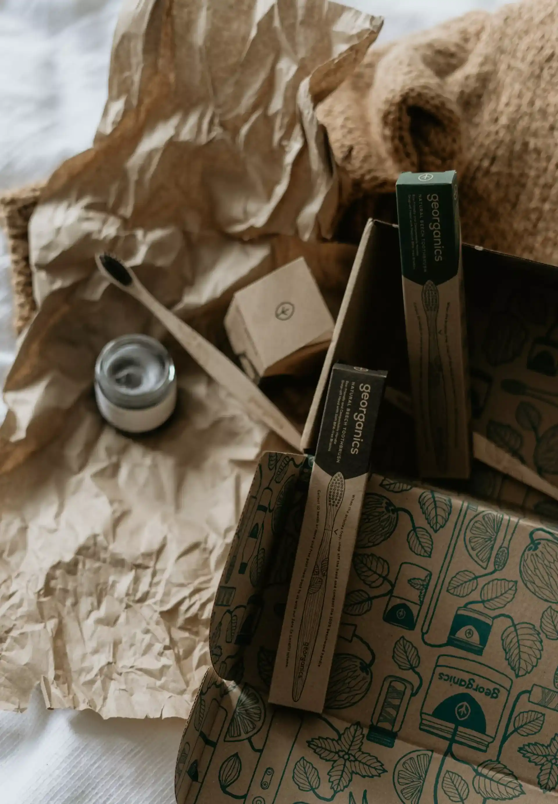 two wooden toothbrushes, in corton boxes